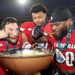 Louisville Players Eat Beans After Win.jpg