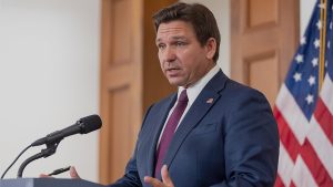 Ron Desantis Stands At Podium.jpg