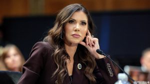 Noem Glance During Hearing.jpeg