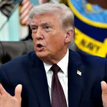 Donald Trump Gesturing Oval Office.jpg